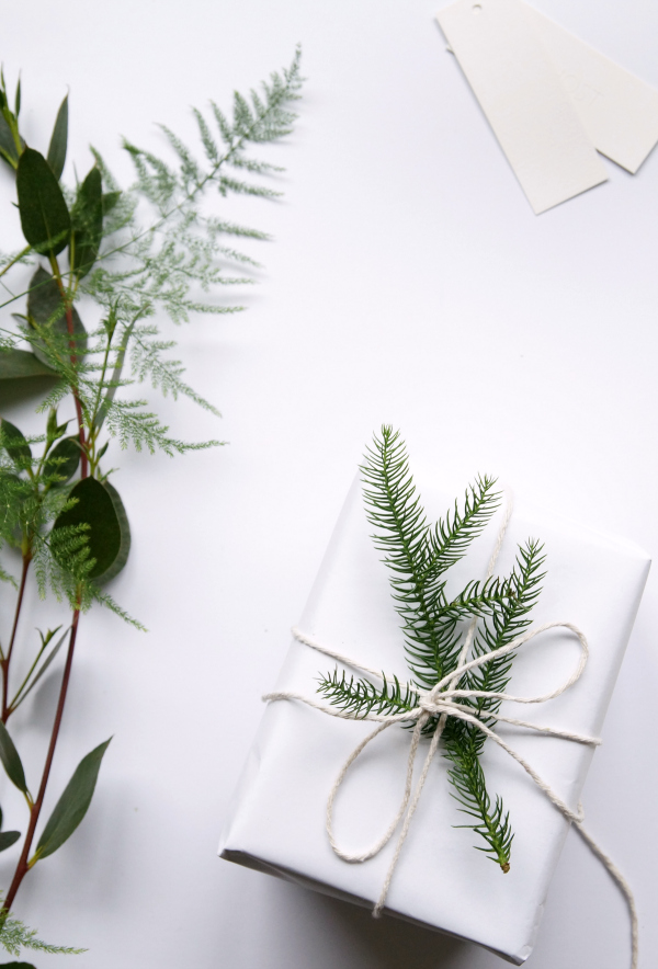 Simple Nordic Christmas gift wrapping with foliage