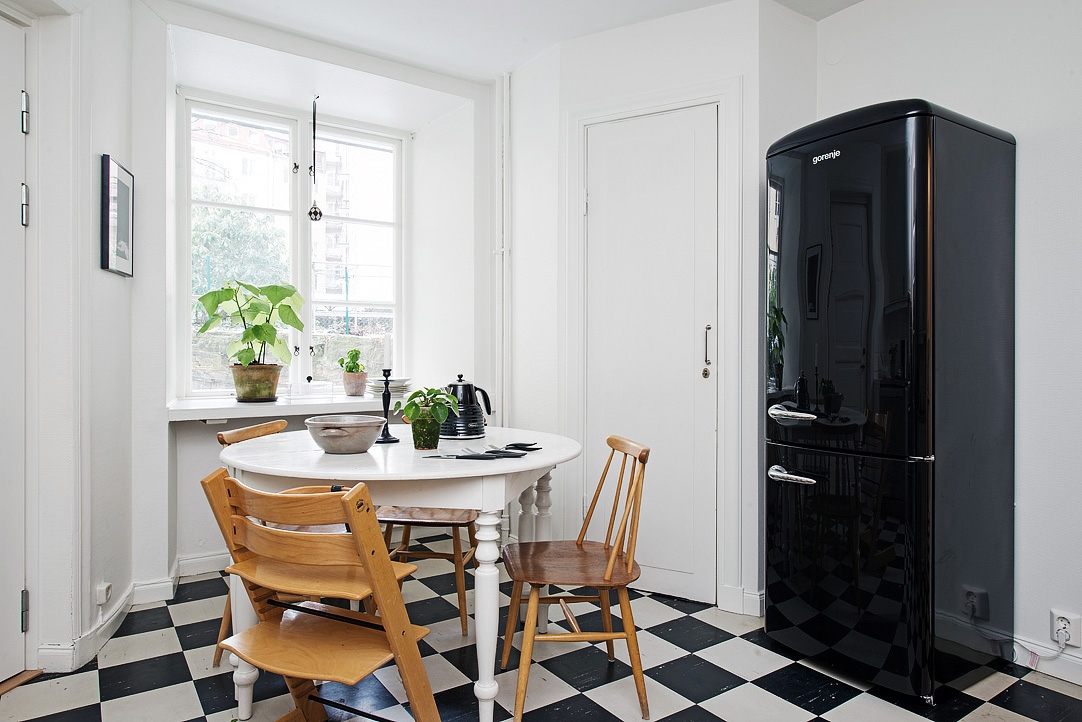 Alvhem natural light kitchen with black fridge freezer