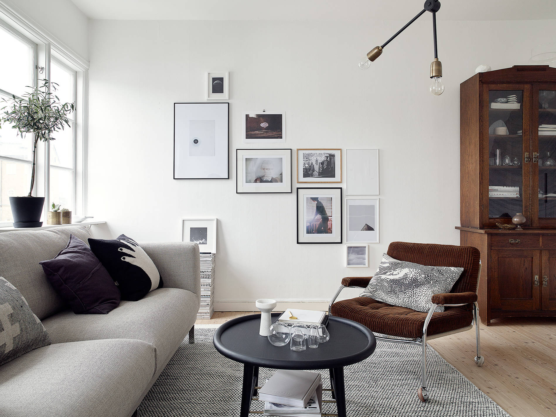mix of pictures in a monochrome living room 