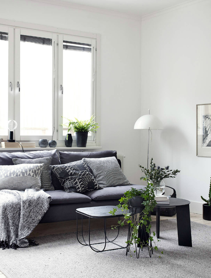 living room showing two coffee tables styled in a minimalist, Scandinavian interior design