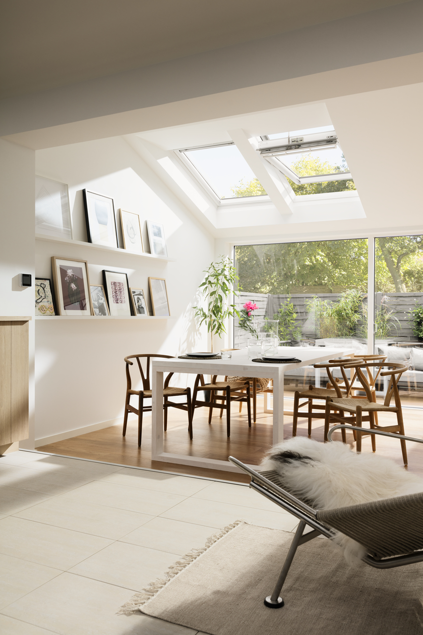bright dining room with velux roof windows