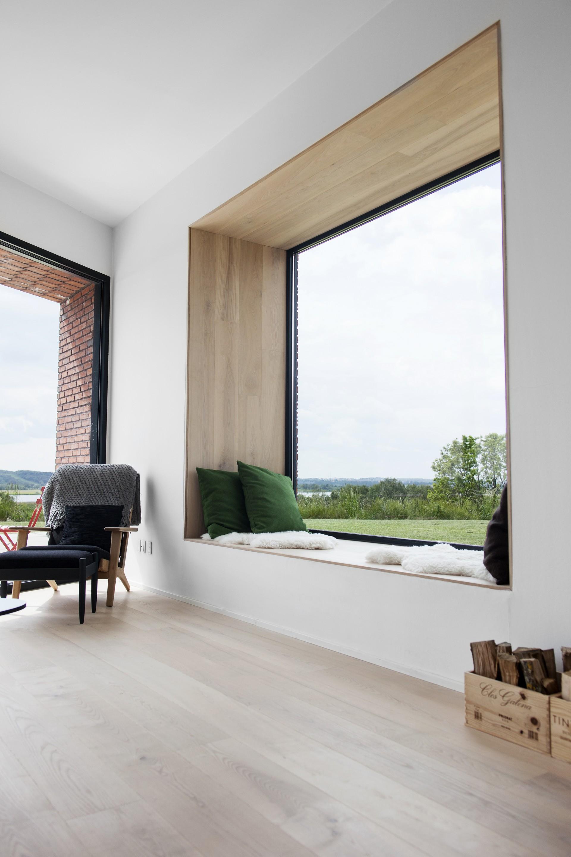 Project by Krads and photos by Runolfur Geir Guobjornsson big window making the space feel larger