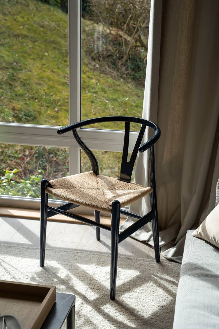 iconic Wishbone chair by the window
