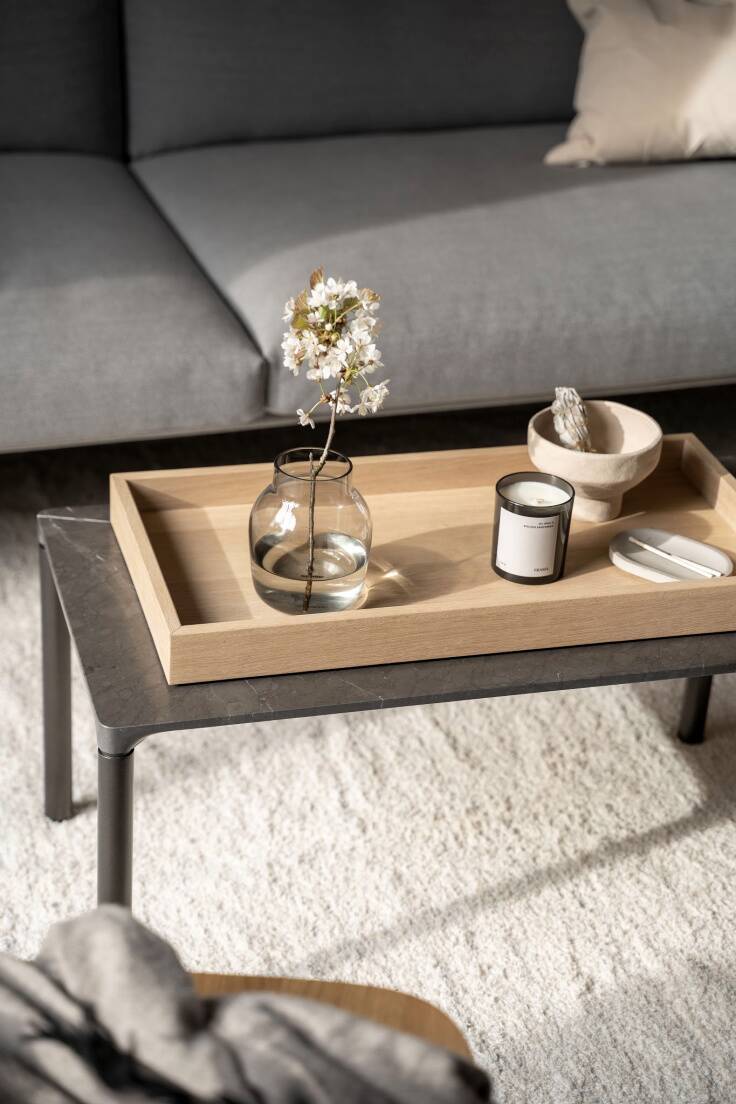 a simple Nordic inspired coffee table setting decorated with spring blossom foliage