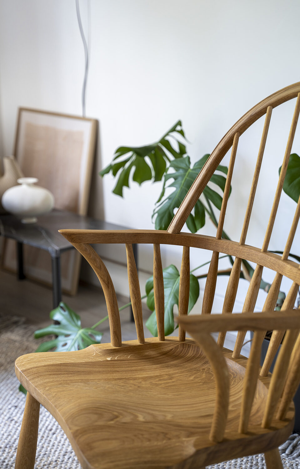 close up of the seat on the Windsor chair, a carefully sculpted wooden chair made for comfort from Carl Hansen