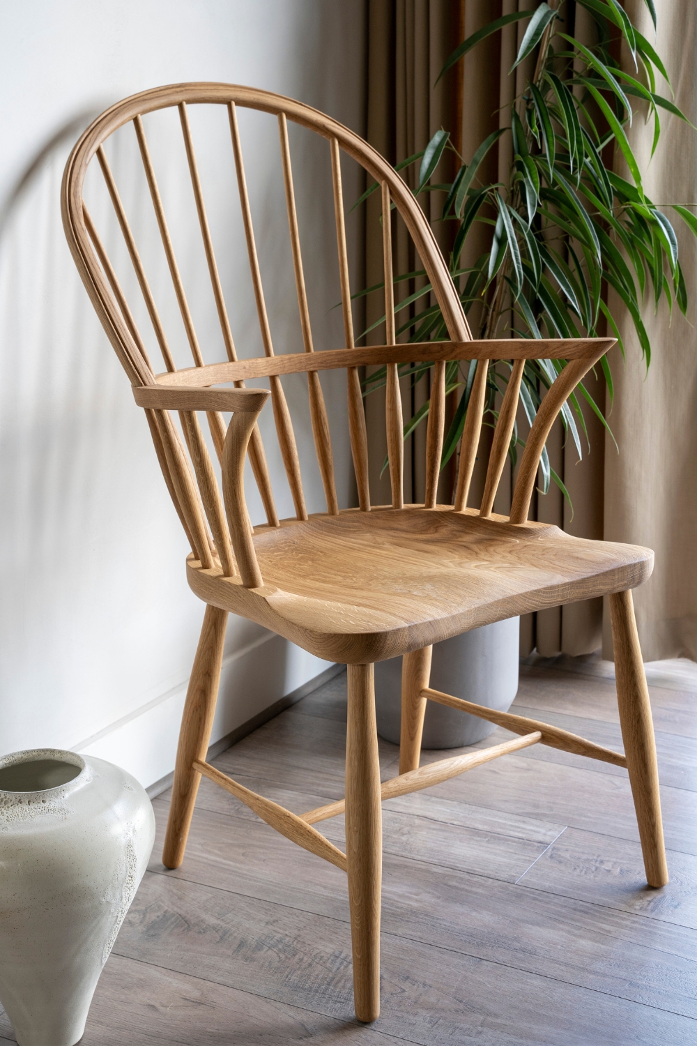 close up of the minimalist Danish designed Windsor chair- a high back chair made with wood ideal for dining and lounge chair
